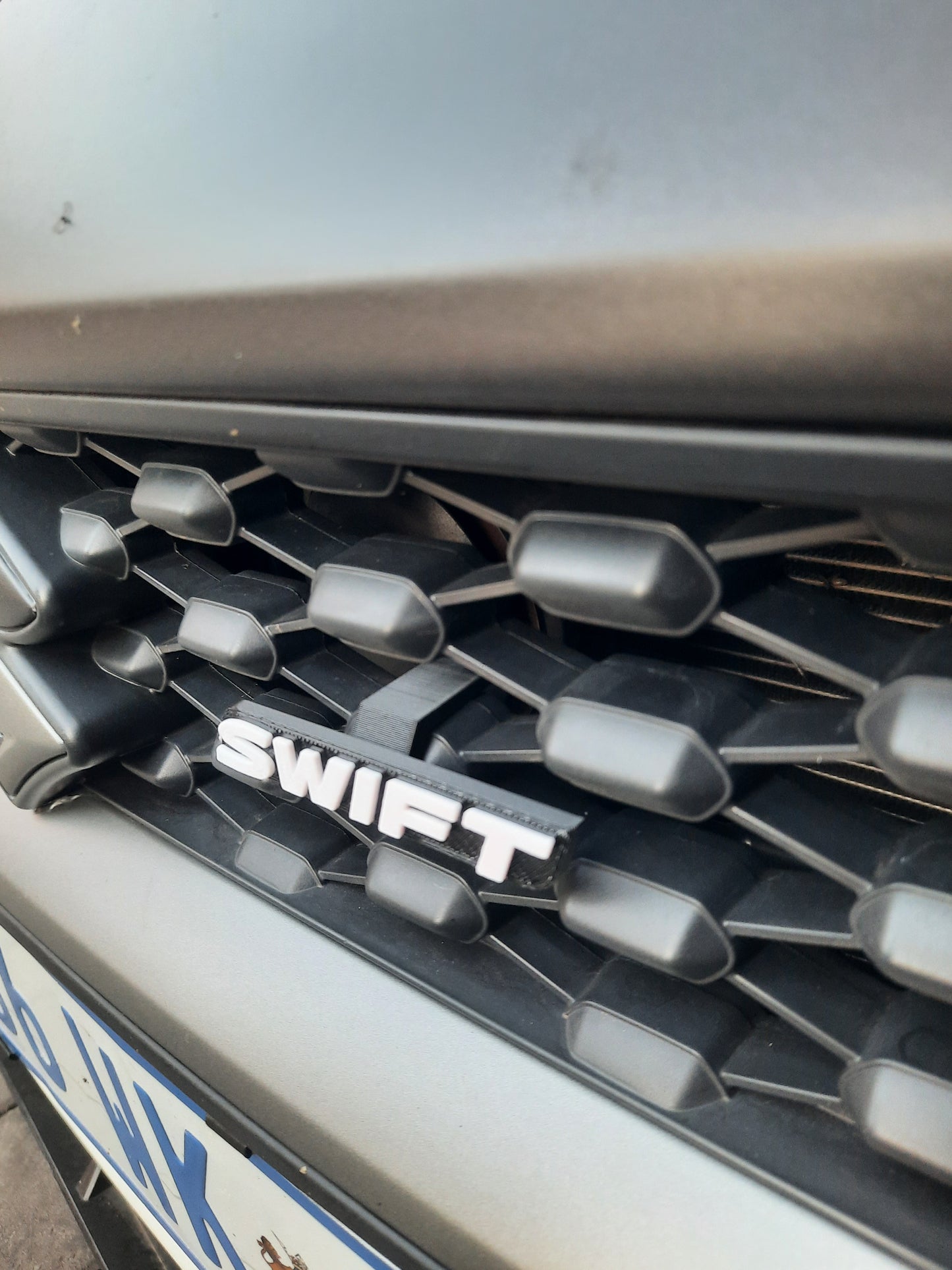 Suzuki Swift GLX Front Grille Badge